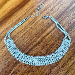 Sparkly choker. Missing two gems